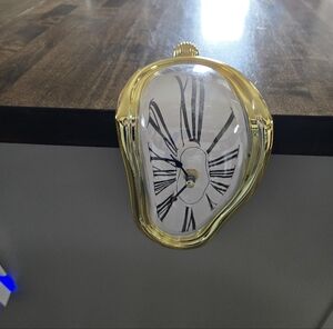 Surreal Melted-Edge Gold Hanging Wall Clock